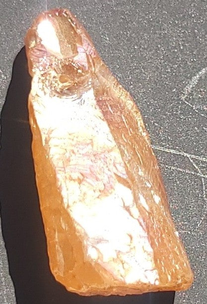 Raw amber golden crystal gemstone available for custom candle creation at Awen Aboros - Champagne Aura Quartz